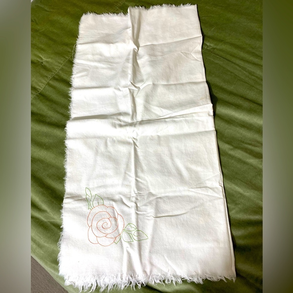 Vintage tablecloth embroidered roses and leaves on corners shows OSB